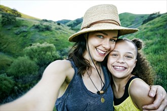 Mother and daughter posing for selfie