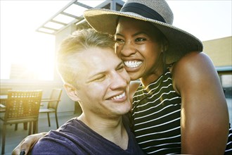 Portrait of smiling couple on rooftop