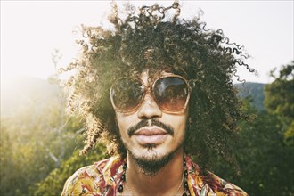 Portrait of Mixed Race man wearing sunglasses