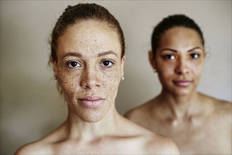 Close up of serious mixed race women
