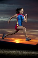 Japanese runner running at sunset