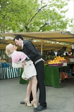 Romantic Caucasian couple at market