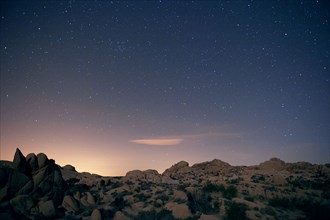 Stars in sky over desert