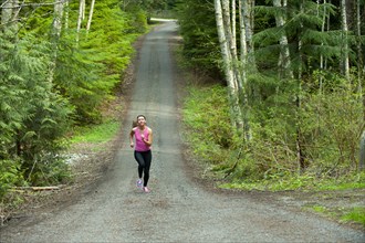 Mixed race runner training on remote road