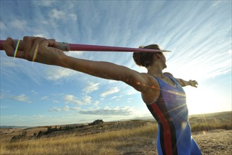 Caucasian athlete aiming javelin