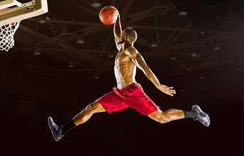 Black man playing basketball