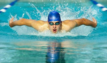 Caucasian swimmer in swimming lane