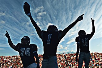 Football players cheering in game