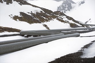 Power plant pipes in arctic landscape