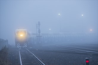 Train light in foggy station
