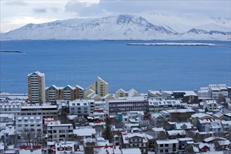 Snowy city and lake in arctic landscape