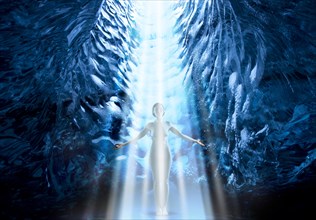 Nude Caucasian woman standing in light rays in ice cave