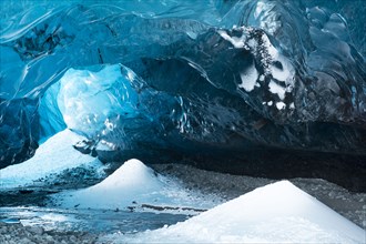 Snow piles and ceiling in ice cave