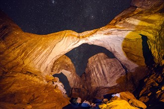 Illuminated rocks at night in Arches National Park