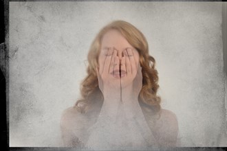 Double exposure of Caucasian woman covering face with hands