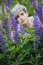 Caucasian woman in field of purple flowers