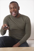 Black man using remote control