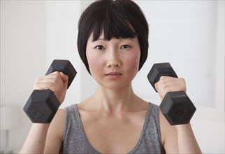 Chinese woman lifting weights