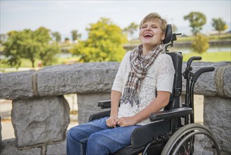 Paraplegic woman laughing in wheelchair