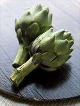 Close up of two artichokes