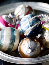 Old-fashioned Christmas ornaments in bowl