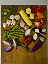 Variety of fresh vegetables on cutting board
