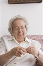 Senior Chilean woman knitting