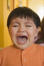 Crying Hispanic baby boy