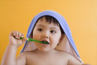 Hispanic boy brushing teeth
