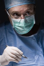 Caucasian surgeon performing surgery