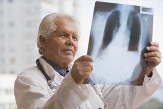 Chilean doctor looking at x-ray