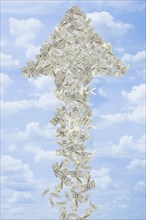 Illustration of dollar bills making arrow in sky