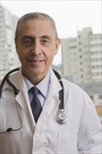 Close up portrait of Hispanic doctor
