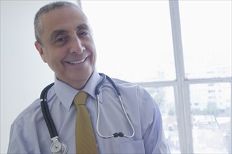 Smiling Hispanic doctor
