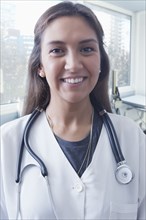 Portrait of smiling Hispanic doctor