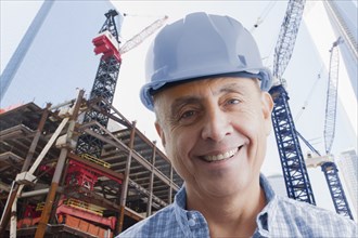 Portrait of smiling Hispanic construction worker