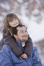 Hispanic daughter hugging father