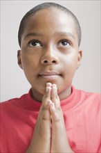 Hispanic boy praying