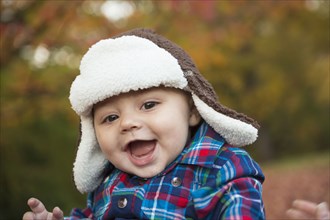 Baby smiling outdoors