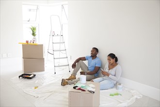 Couple relaxing in new home