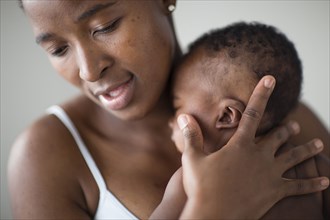 Close up of Black mother comforting baby