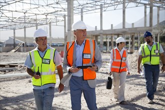 Architects talking at construction site