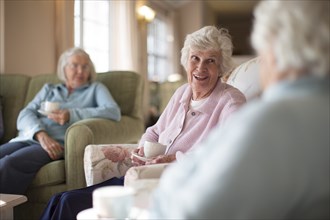 Older Caucasian women talking in nursing home