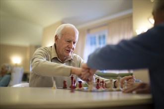 Older men playing chess