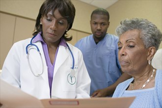 African female doctor with co-workers
