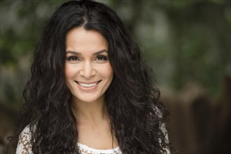 Hispanic woman smiling outdoors