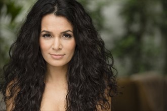 Hispanic woman standing outdoors