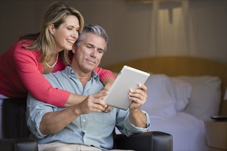Caucasian couple using tablet computer