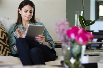 Caucasian woman using tablet computer