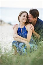 Couple smiling together on beach